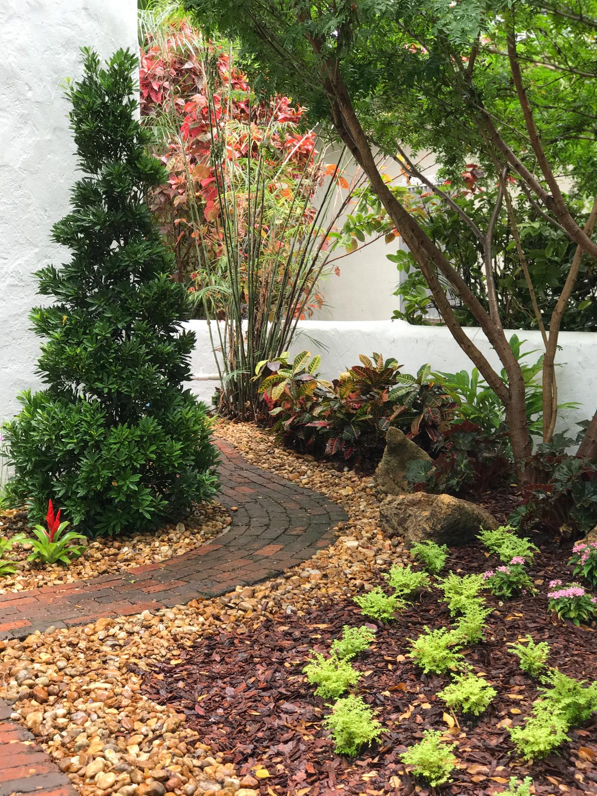 Curved Brick Pathway with Tropical Border