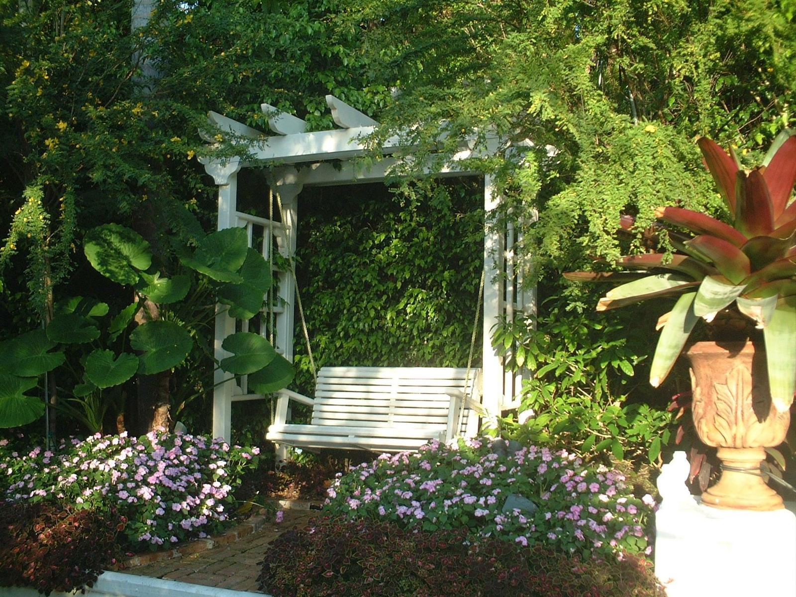Garden Swing Pergola with Flowering Vines